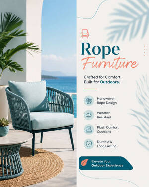 A modern, handwoven rope armchair with plush light blue cushions on a balcony overlooking the ocean.