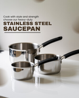 A set of three stainless steel saucepans of varying sizes on a white surface.