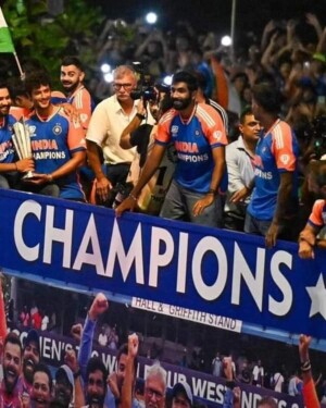 Indian cricket team celebrating a championship win with a trophy and banner.