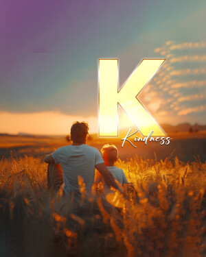 Father and son silhouetted against a sunset with a large letter 'K' representing kindness.