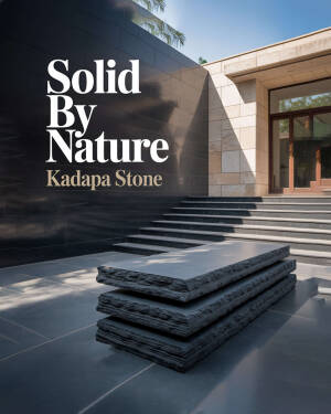 Modern building exterior featuring black Kadapa stone wall, steps, and a raw stacked stone centerpiece
