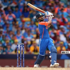 Virat Kohli playing a cricket shot during a match