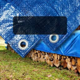Blue Tarp Covering Stacked Firewood Image For LinkedIn