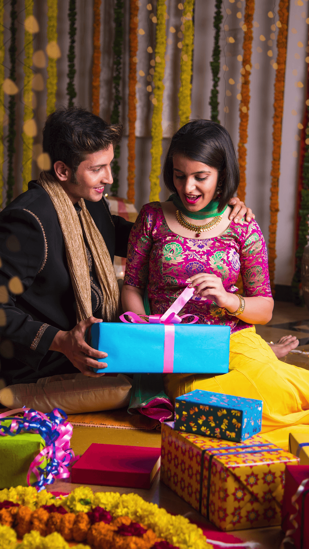 Couple Exchanging Diwali Gifts Design For Twitter